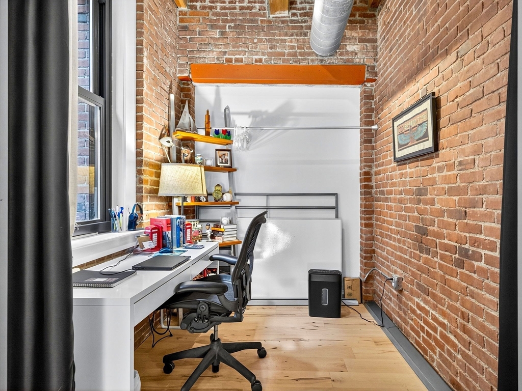 9 West Broadway, Unit 206 Boston, MA 02127 - Photo 7 of 25 a view of balcony with two chairs and a window