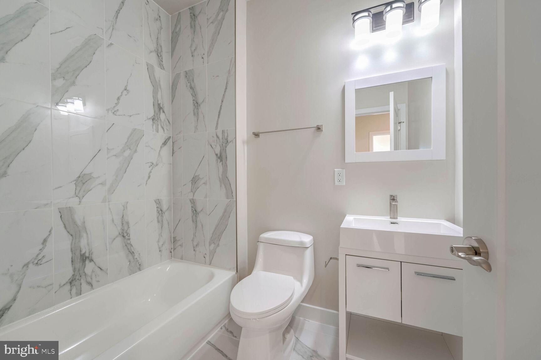 2514 Elvans Road Southeast Washington, DC 20020 - Photo 12 of 25 a bathroom with a sink toilet and shower
