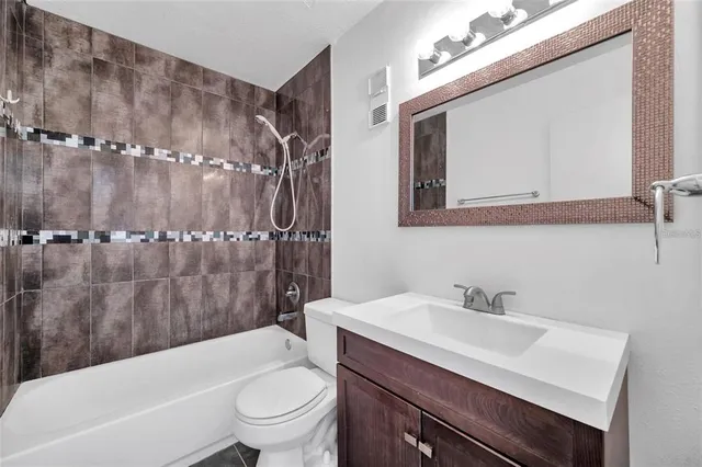 a bathroom with a sink a toilet and a bathtub