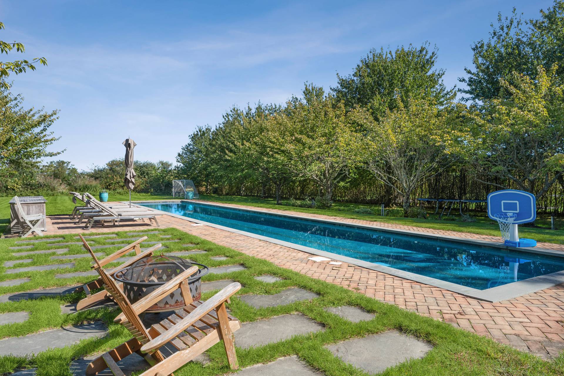 a view of a swimming pool with a patio