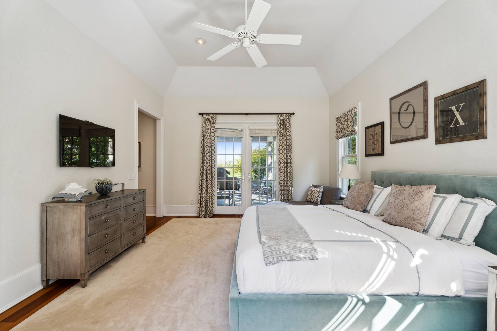 25 Jordan Drive Water Mill, NY 11976 - Photo 25 of 43 a spacious bedroom with a bed and a flat screen television