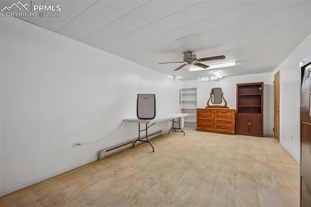 a bed room with a bed and a wooden floor