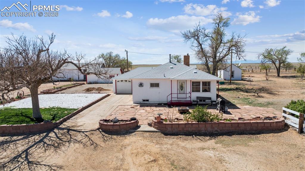 6771 Boone Road Boone, CO 81025 - Photo 10 of 49 a view of a house with backyard sitting area and fire pit