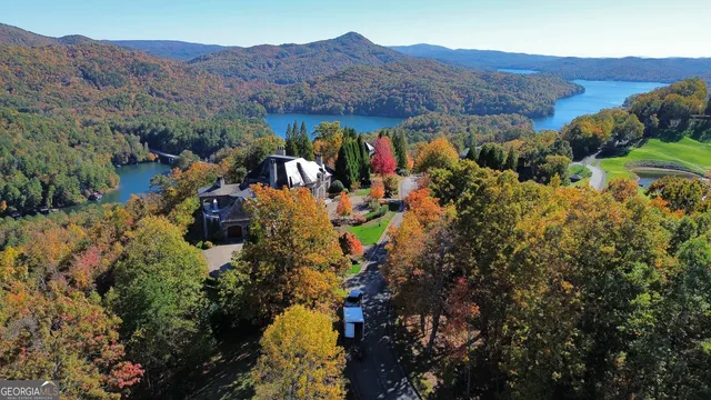 a view of empty room with wooden floor and fireplace