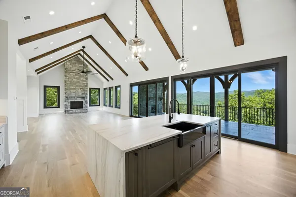 a kitchen with a refrigerator and a sink
