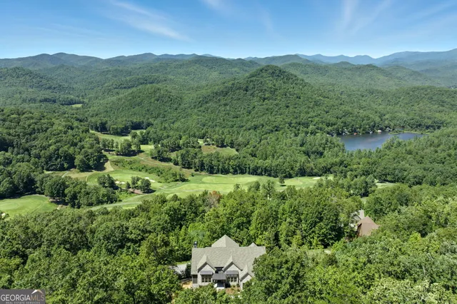 an aerial view of a house with mountain view