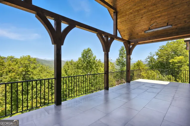 a bathroom with a granite countertop sink toilet and mirror
