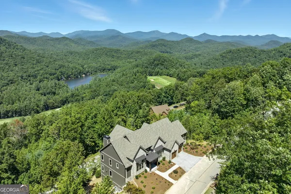 an aerial view of a house with mountain view