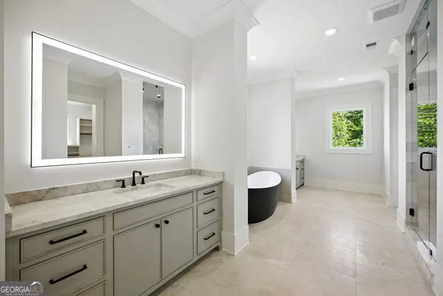 a view of a lush green hillside and houses