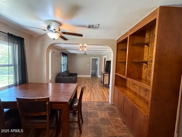 a dining room with furniture and window