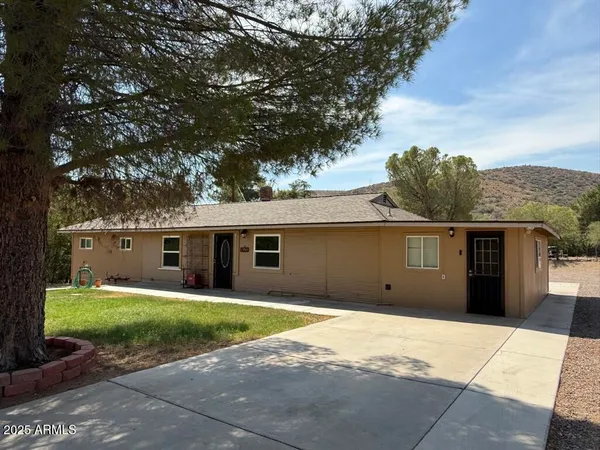 a house with yard in front of it