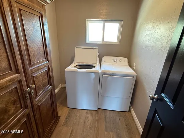 a view of a room with washer and dryer