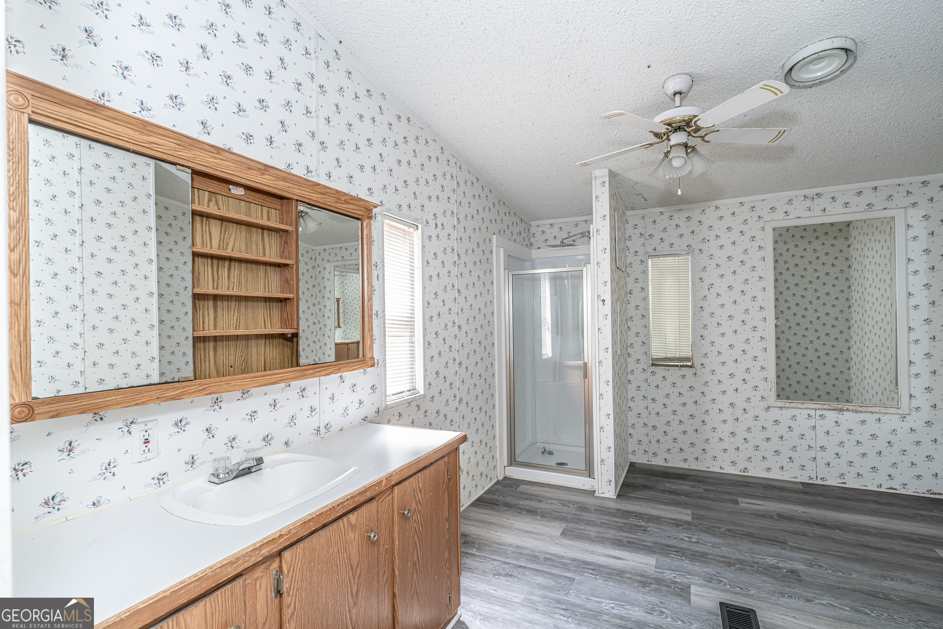 71 Kirk Road Northwest White, GA 30184 - Photo 19 of 43 a bathroom with a sink and a mirror