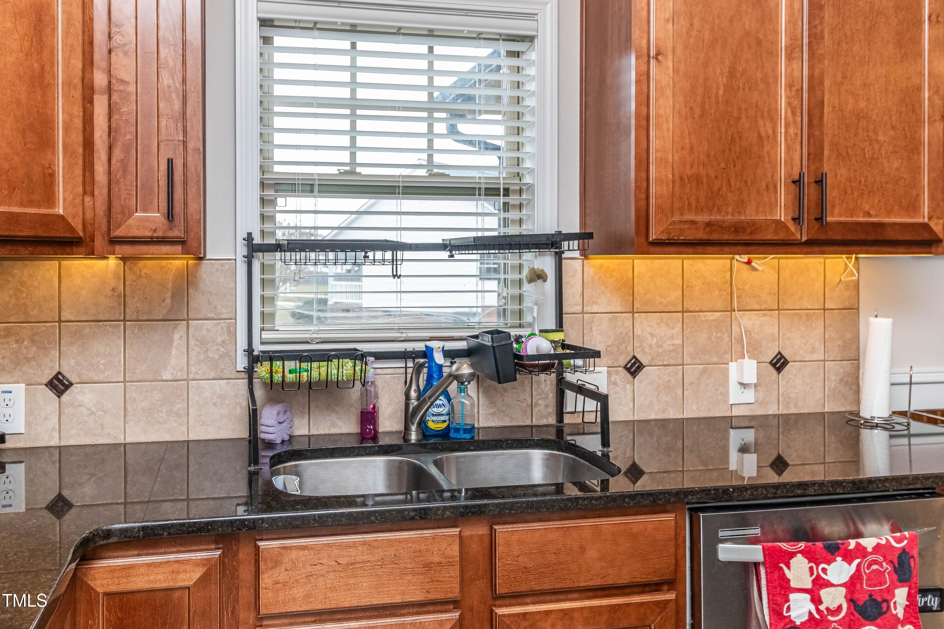1852 Alderman Mill Road Dunn, NC 28334 - Photo 14 of 36 a kitchen with a sink and a window