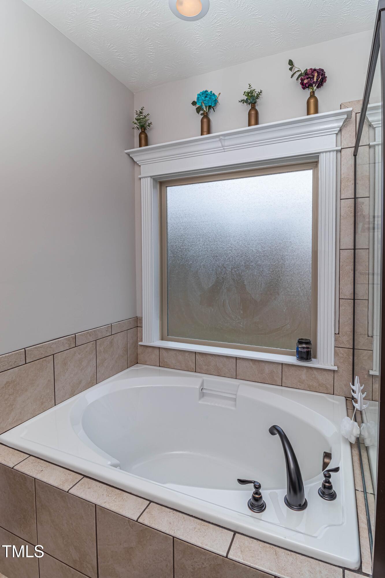 1852 Alderman Mill Road Dunn, NC 28334 - Photo 29 of 36 a bathroom with a bathtub and shower