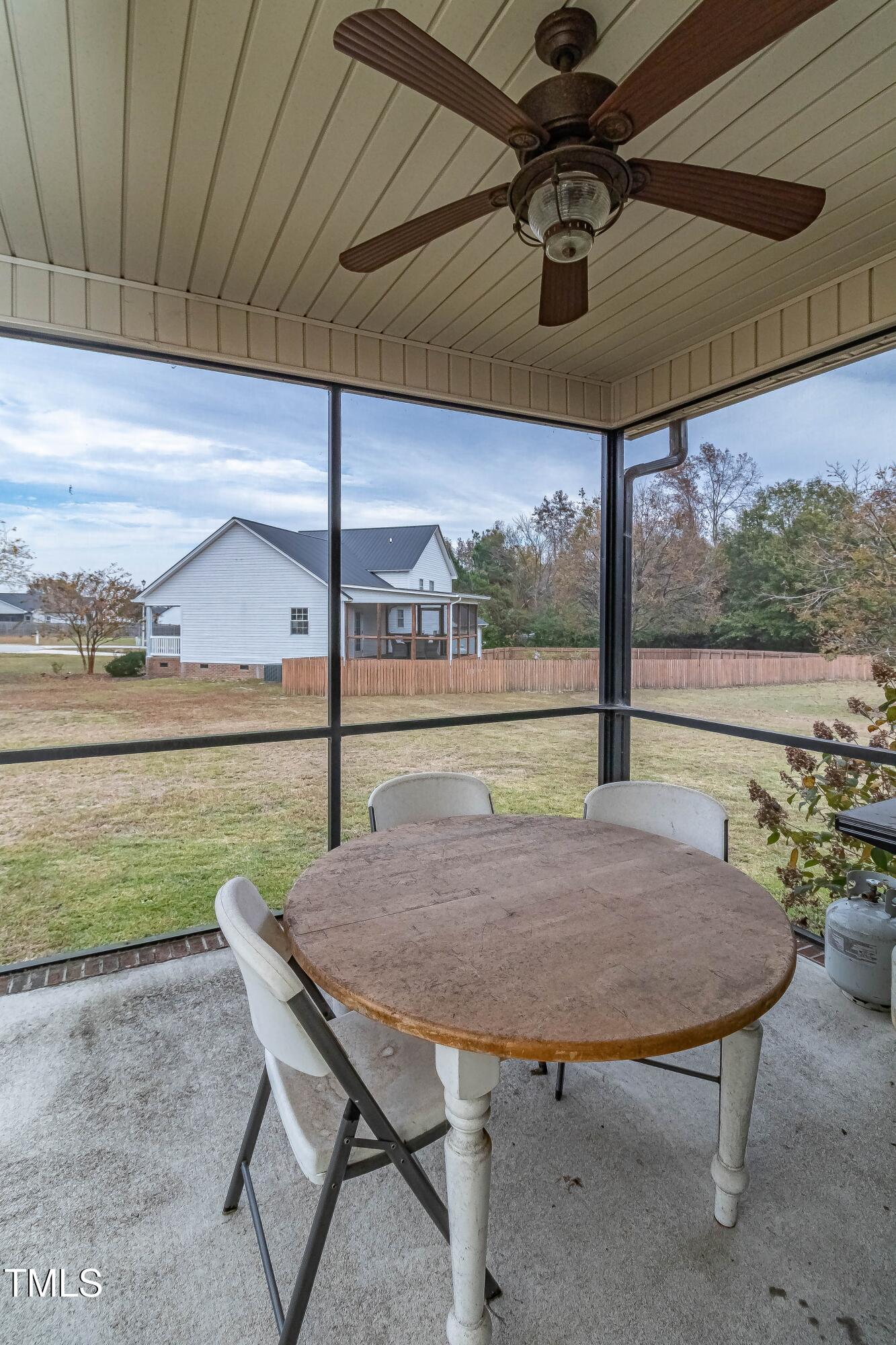 1852 Alderman Mill Road Dunn, NC 28334 - Photo 34 of 36 a view of a patio with a table chairs and a swimming pool