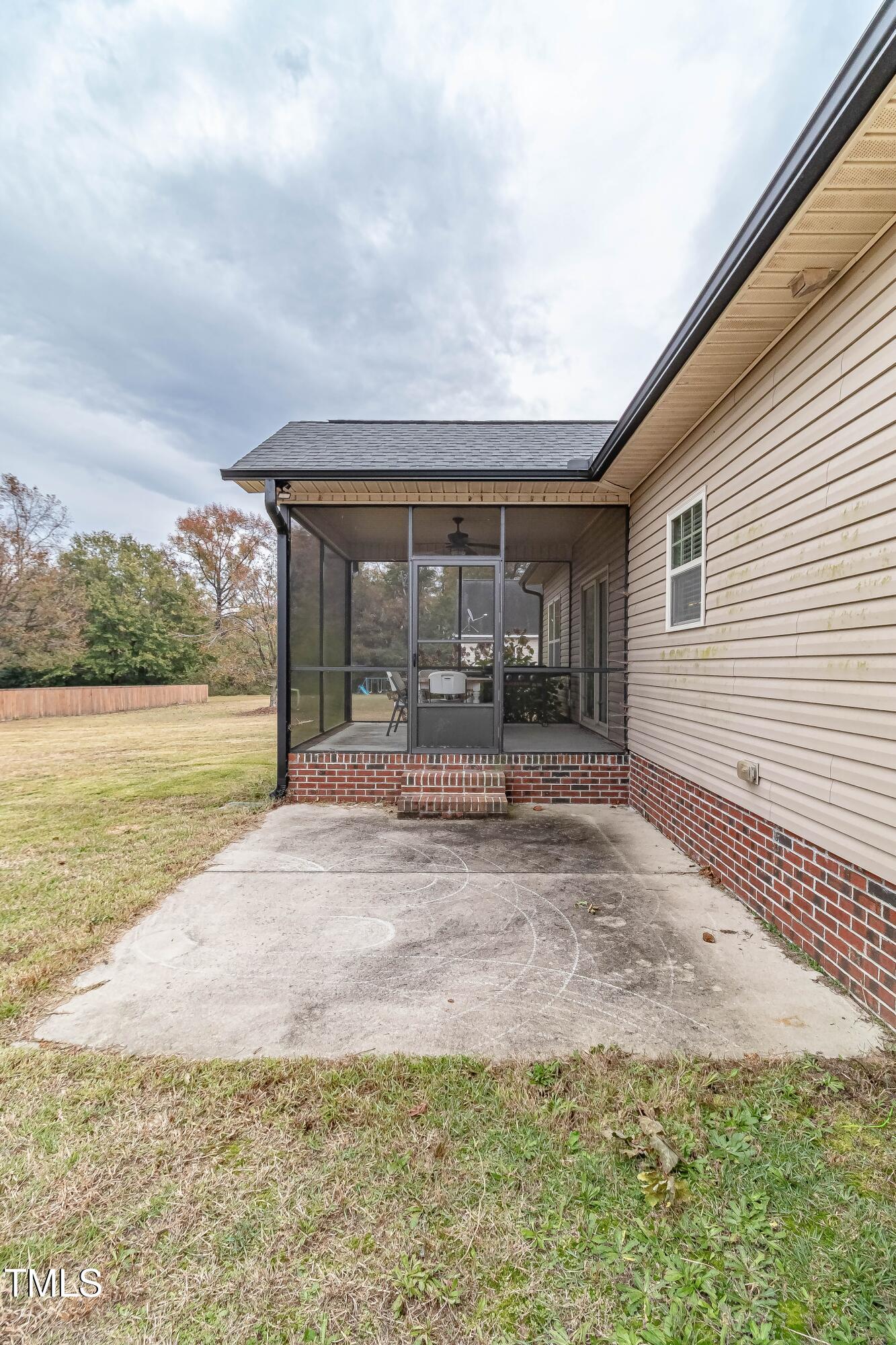 1852 Alderman Mill Road Dunn, NC 28334 - Photo 35 of 36 a view of a house with backyard and porch