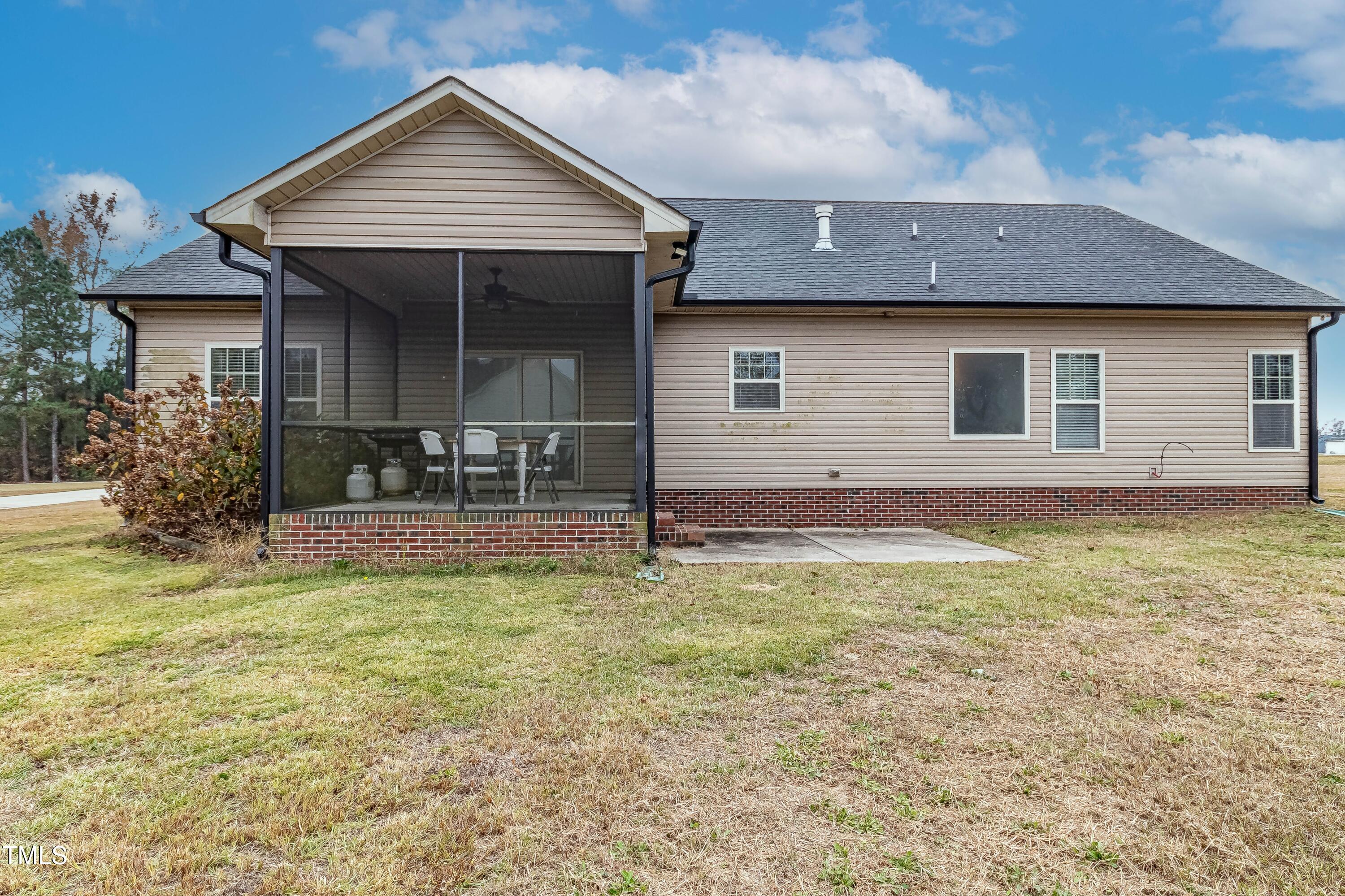 1852 Alderman Mill Road Dunn, NC 28334 - Photo 36 of 36 a house view with a garden space