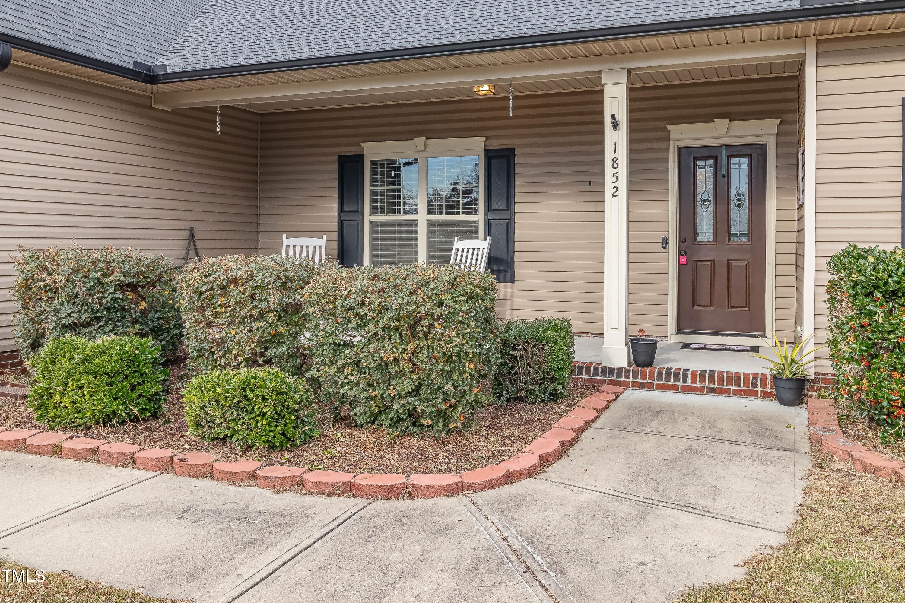 1852 Alderman Mill Road Dunn, NC 28334 - Photo 4 of 36 a view of a house with a pathway