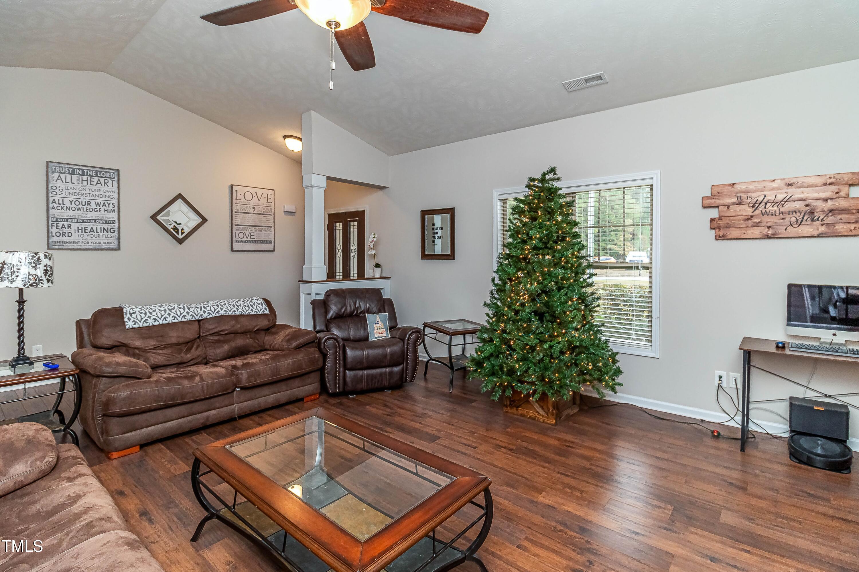 1852 Alderman Mill Road Dunn, NC 28334 - Photo 10 of 36 a living room with furniture and a potted plant