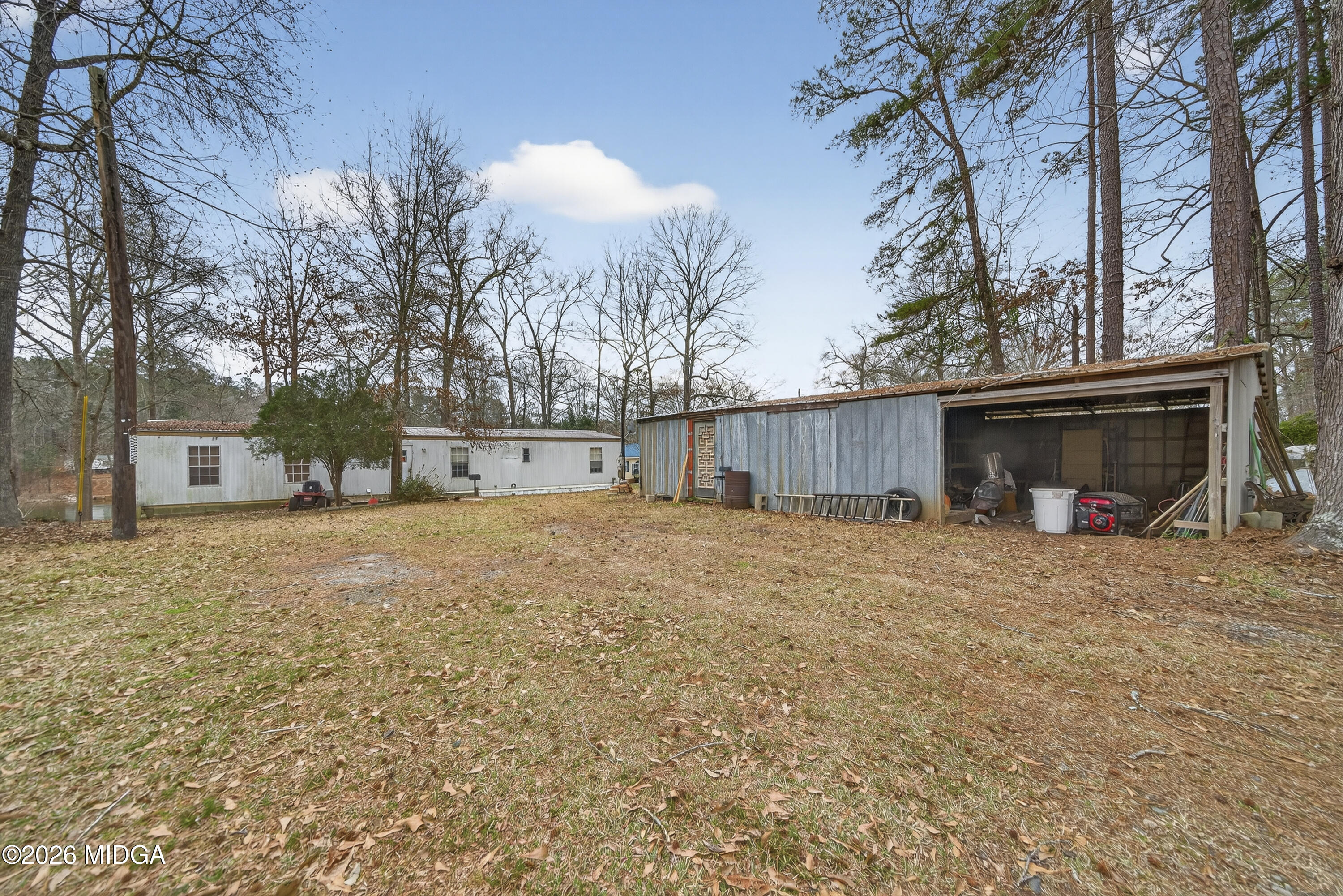 109 Cold Branch Lane Eatonton, GA 31024 - Photo 18 of 35 a view of a house with a yard and garage