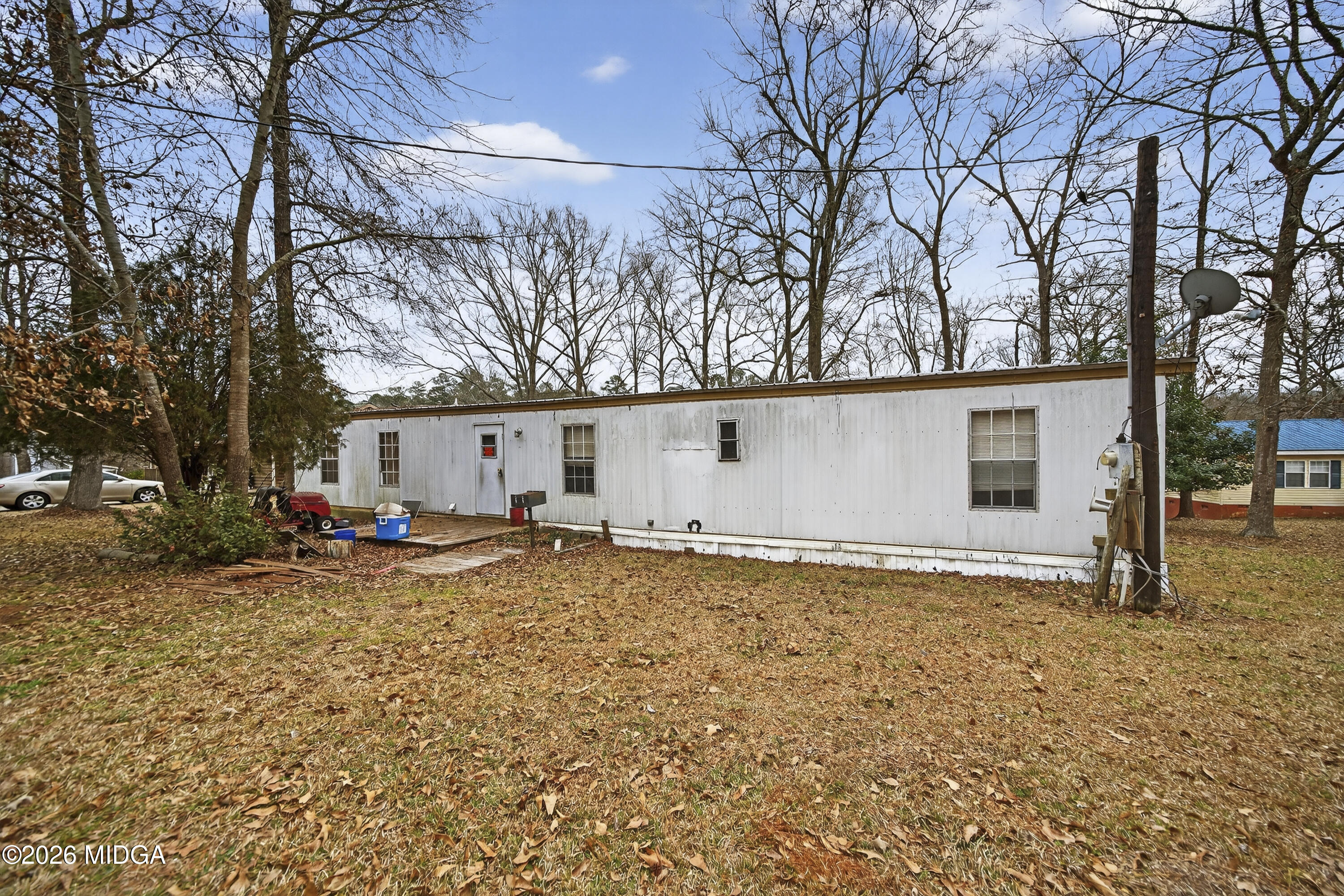 109 Cold Branch Lane Eatonton, GA 31024 - Photo 20 of 35 a view of a house with a snow on the road and trees