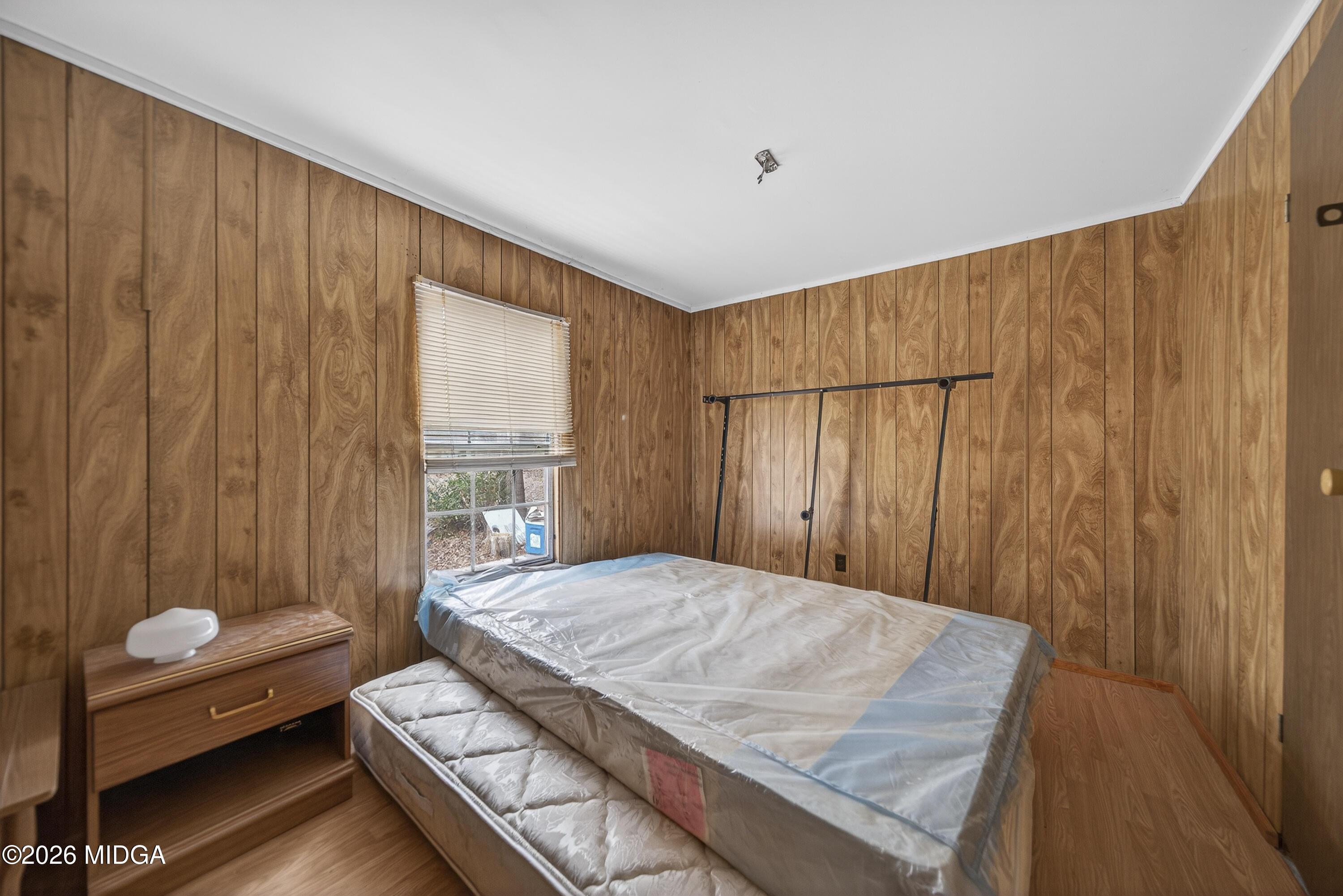 109 Cold Branch Lane Eatonton, GA 31024 - Photo 27 of 35 a bedroom with a bed and a window