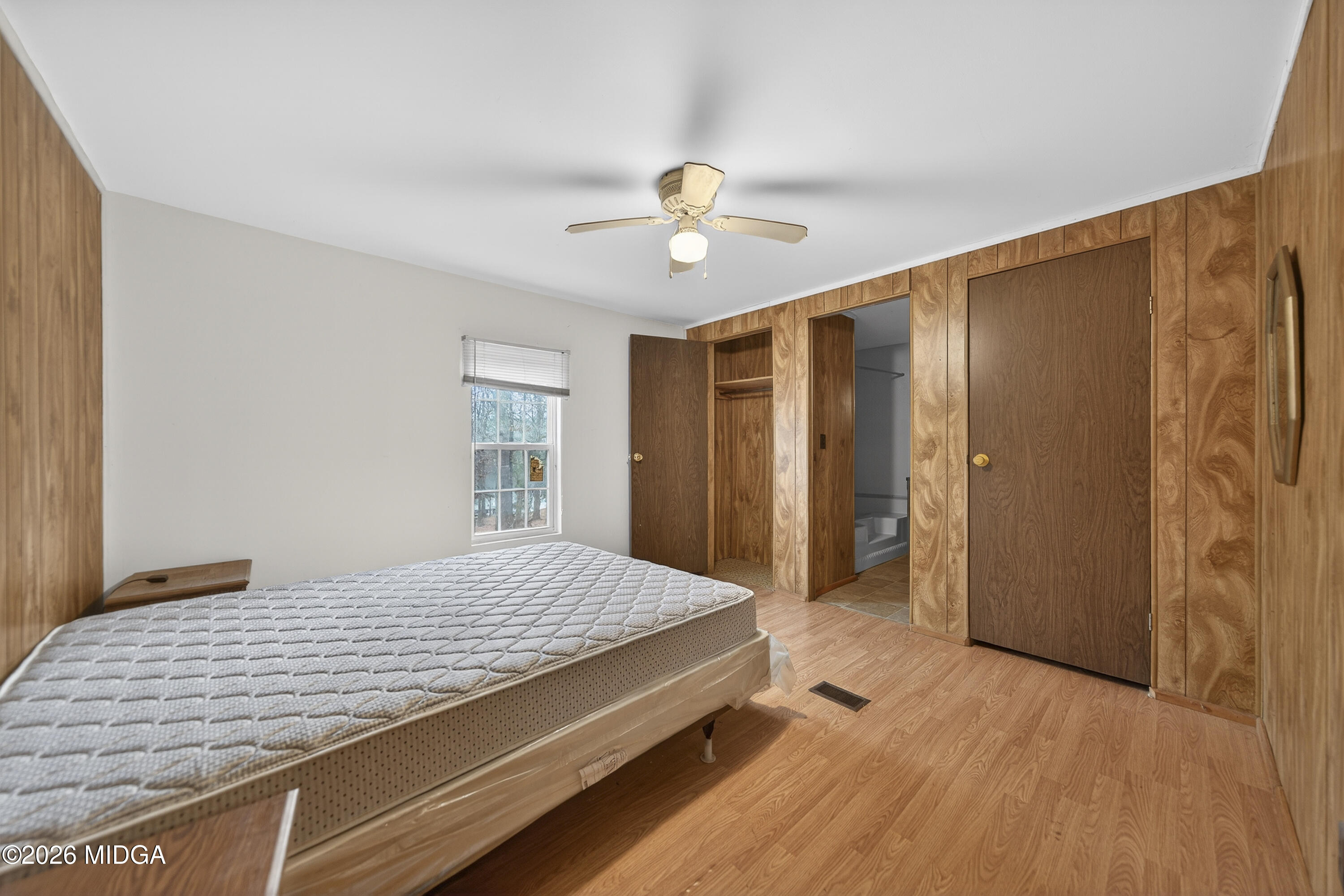 109 Cold Branch Lane Eatonton, GA 31024 - Photo 28 of 35 a bedroom with a bed dresser and a window