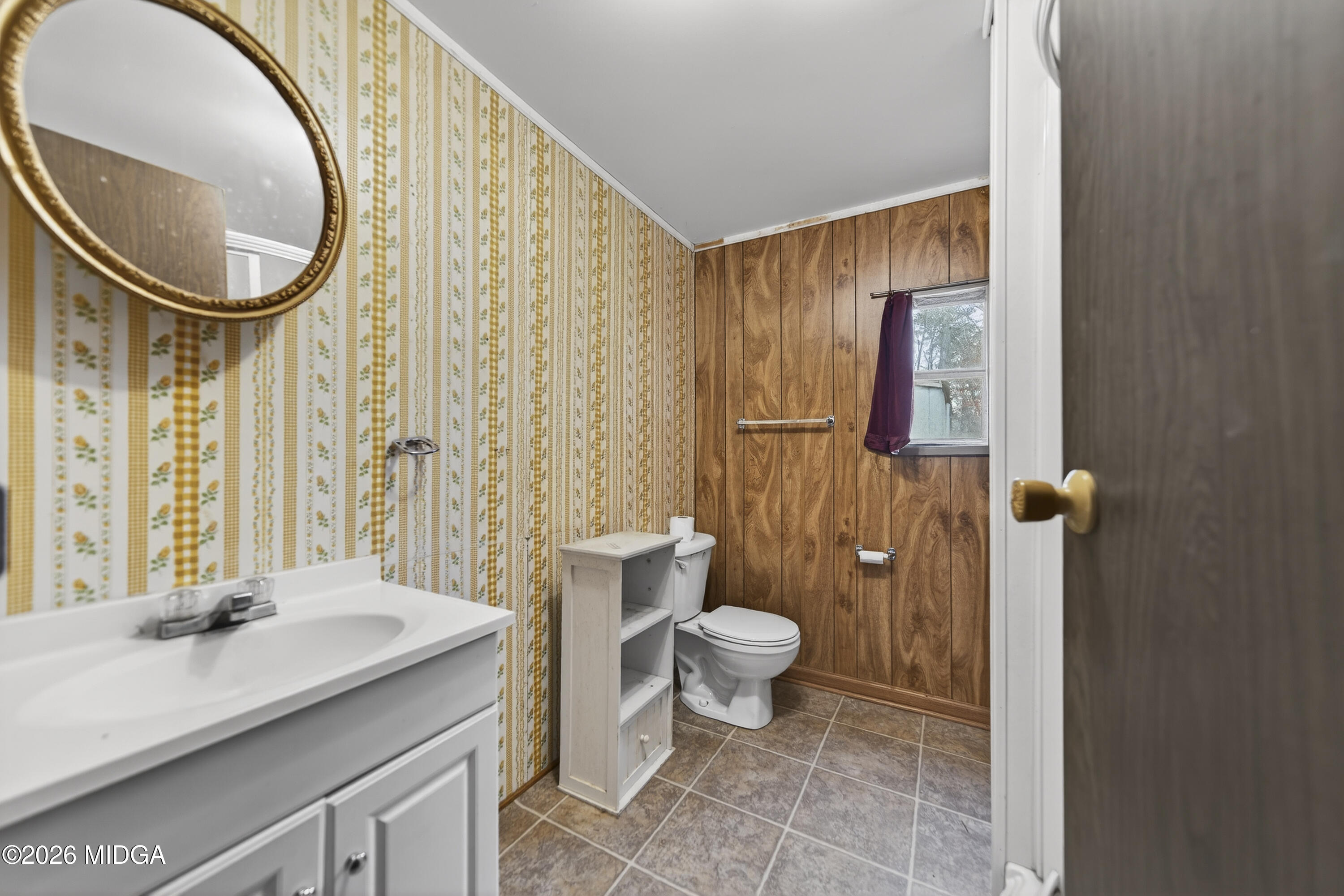 109 Cold Branch Lane Eatonton, GA 31024 - Photo 32 of 35 a bathroom with a toilet sink and mirror