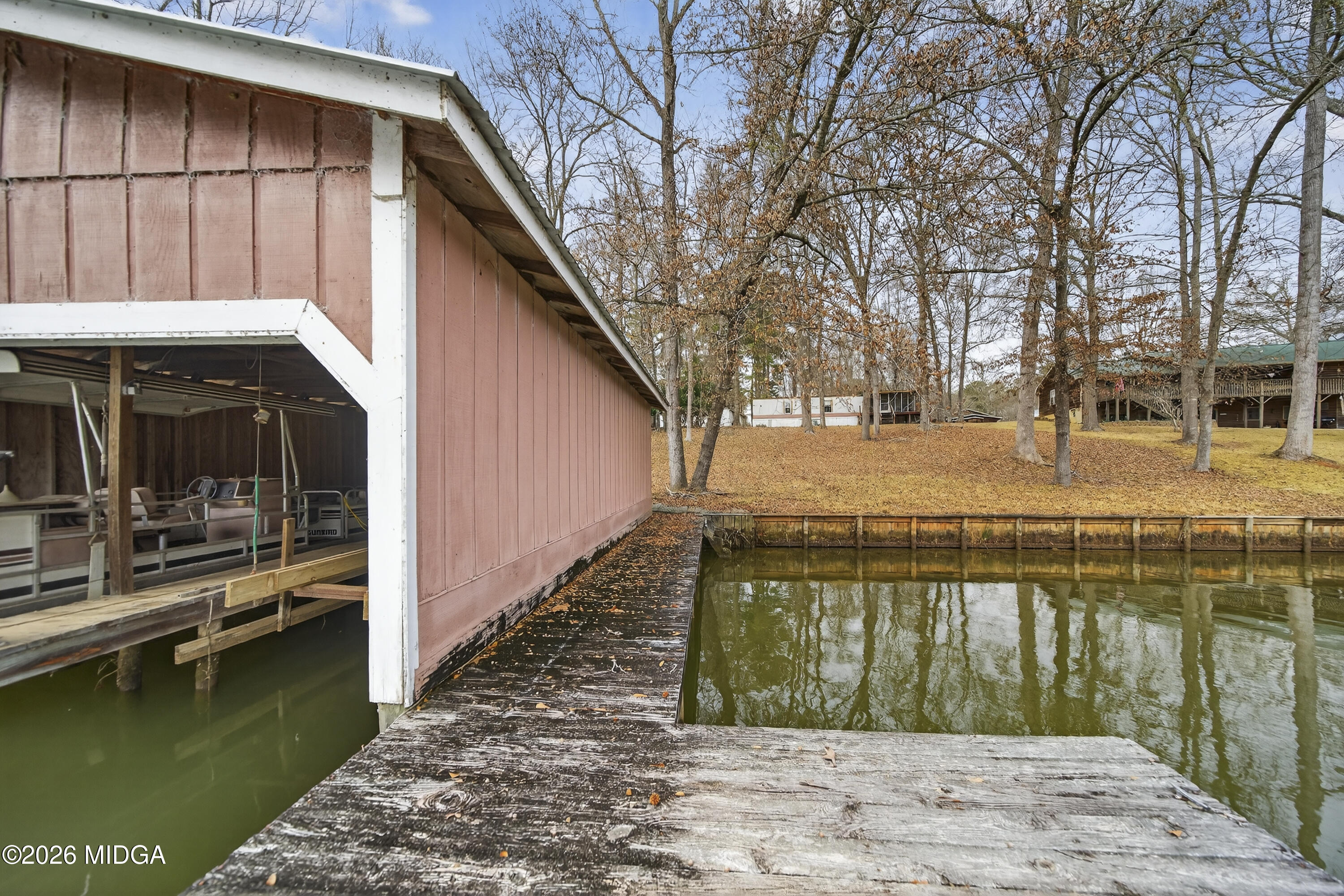 109 Cold Branch Lane Eatonton, GA 31024 - Photo 5 of 35 a view of swimming pool with outdoor seating and lake view