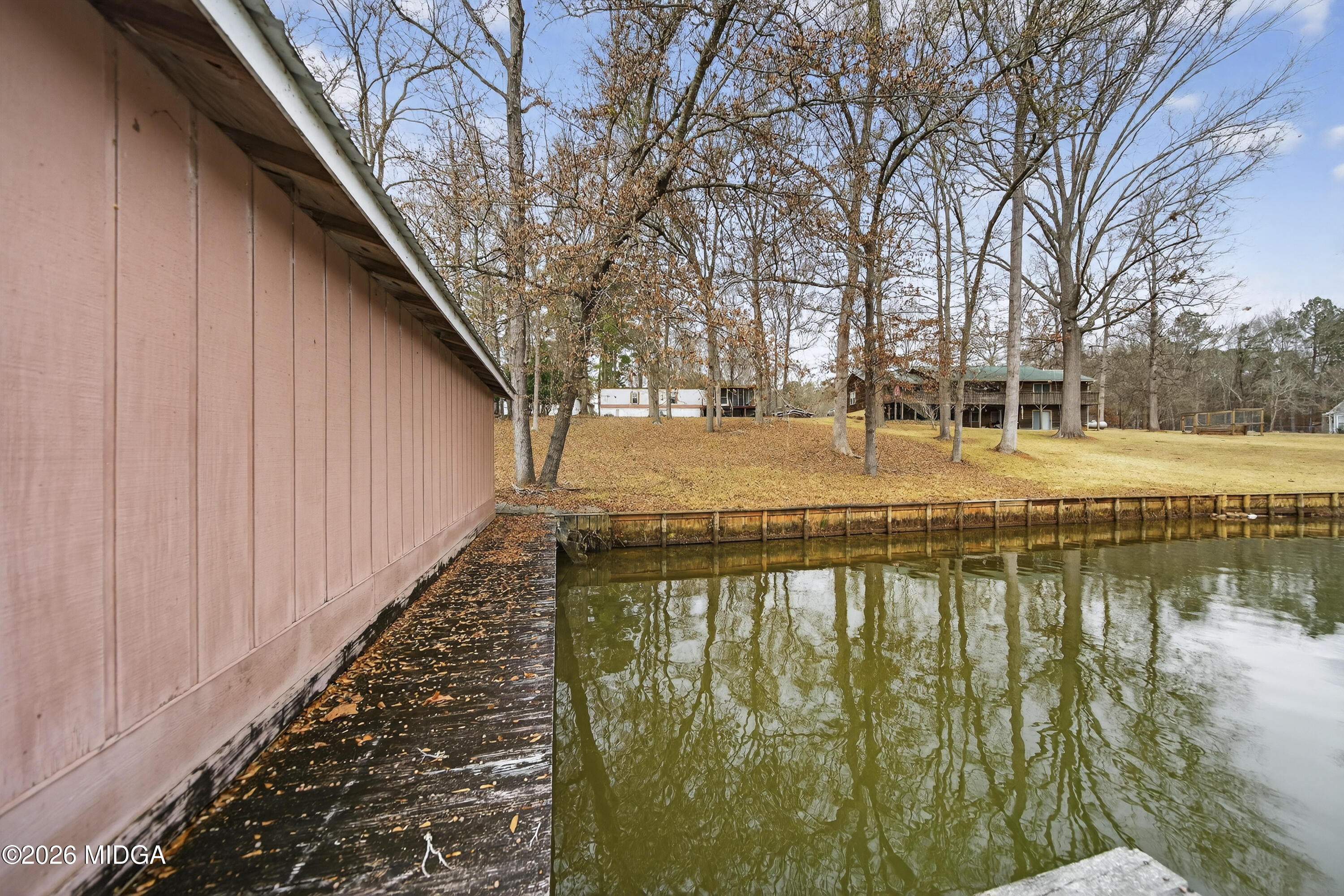 109 Cold Branch Lane Eatonton, GA 31024 - Photo 6 of 35 a view of swimming pool with outdoor space and lake view
