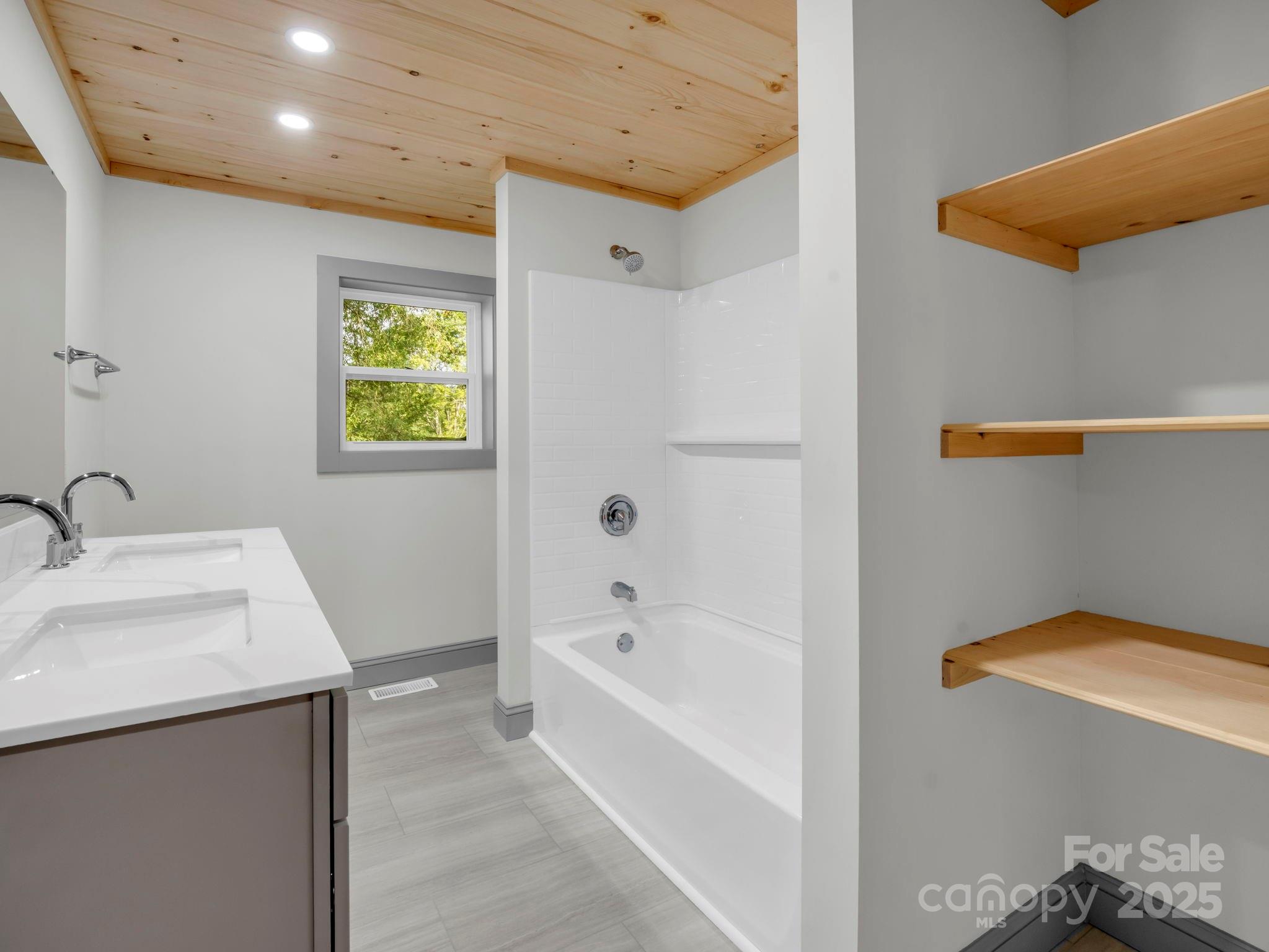 339 Flack Road Forest City, NC 28043 - Photo 12 of 32 a bathroom with a sink a toilet and bathtub