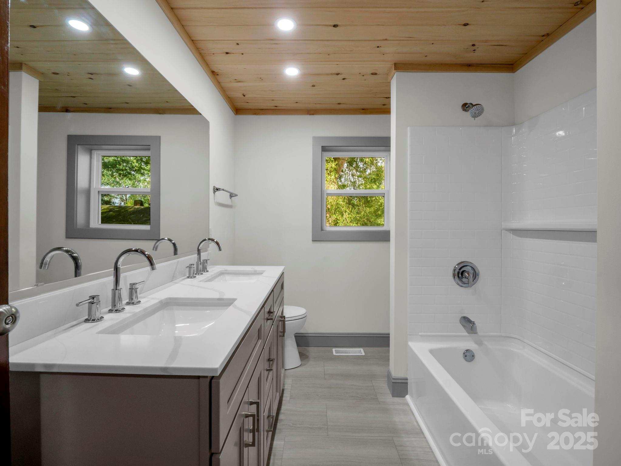 339 Flack Road Forest City, NC 28043 - Photo 13 of 32 a bathroom with a tub sink and mirror