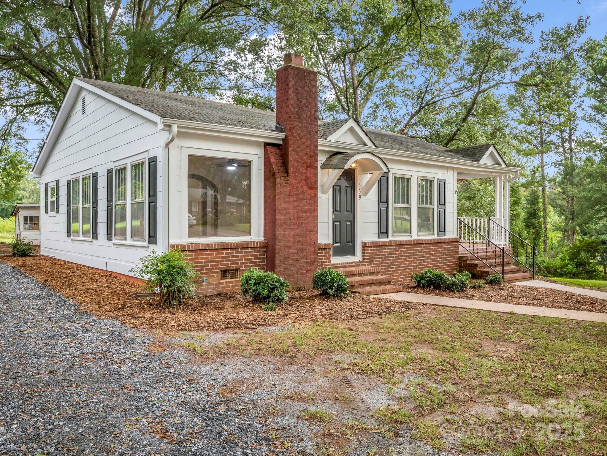 339 Flack Road Forest City, NC 28043 - Photo 14 of 32 a front view of a house with garden