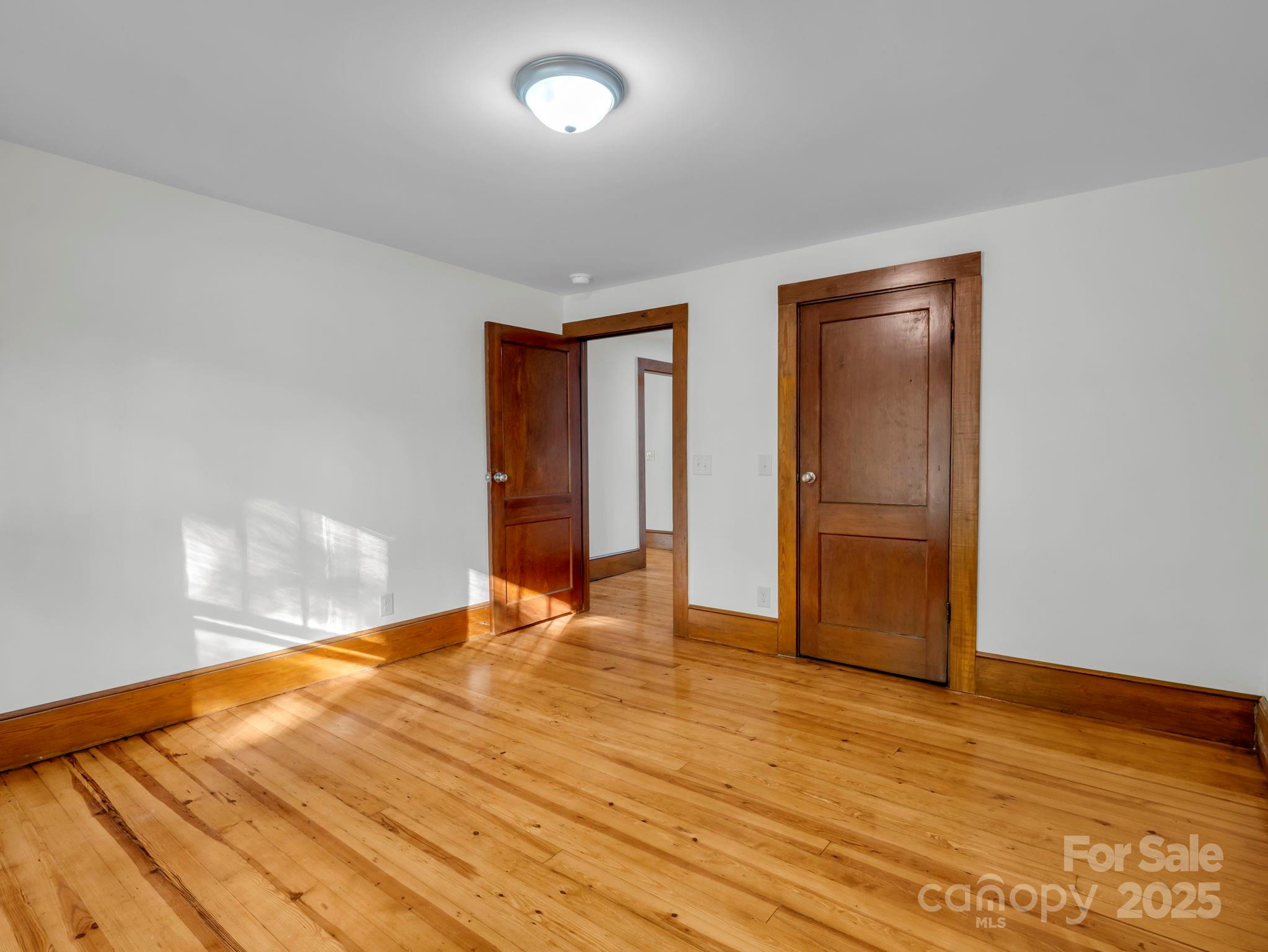 339 Flack Road Forest City, NC 28043 - Photo 16 of 32 a view of empty room with wooden floor and fan