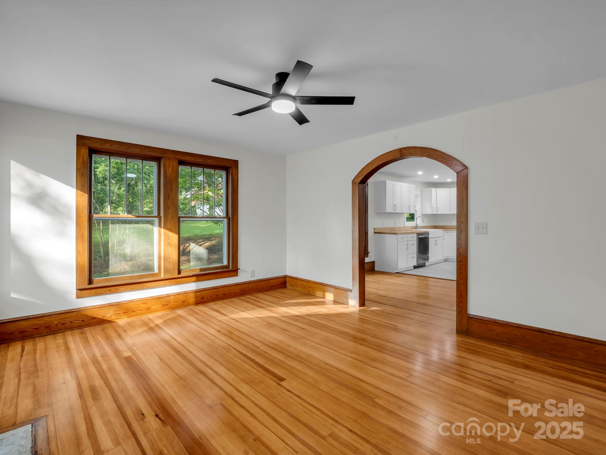 339 Flack Road Forest City, NC 28043 - Photo 19 of 32 a view of empty room with wooden floor and fan