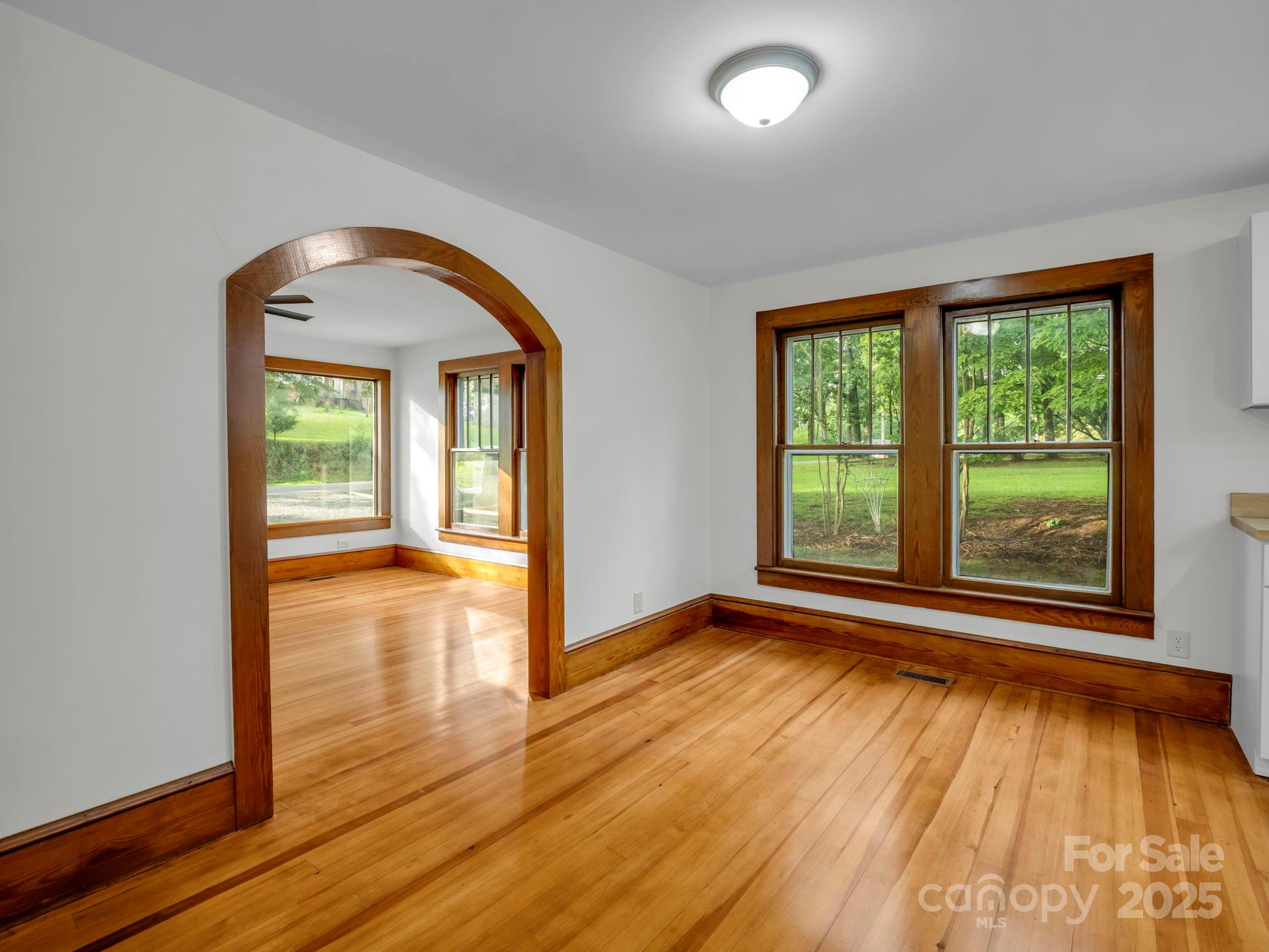 339 Flack Road Forest City, NC 28043 - Photo 22 of 32 a view of empty room with wooden floor and fan
