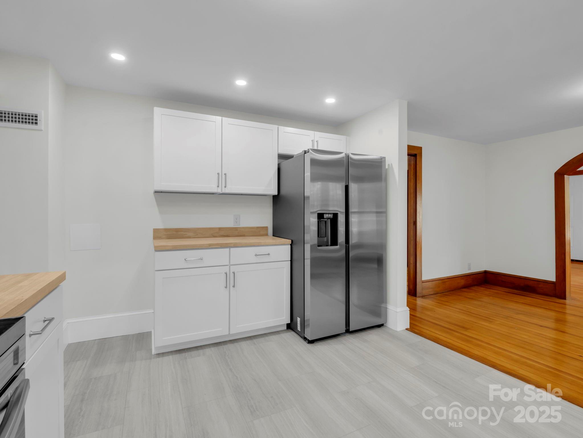 339 Flack Road Forest City, NC 28043 - Photo 26 of 32 a kitchen with a refrigerator and a sink