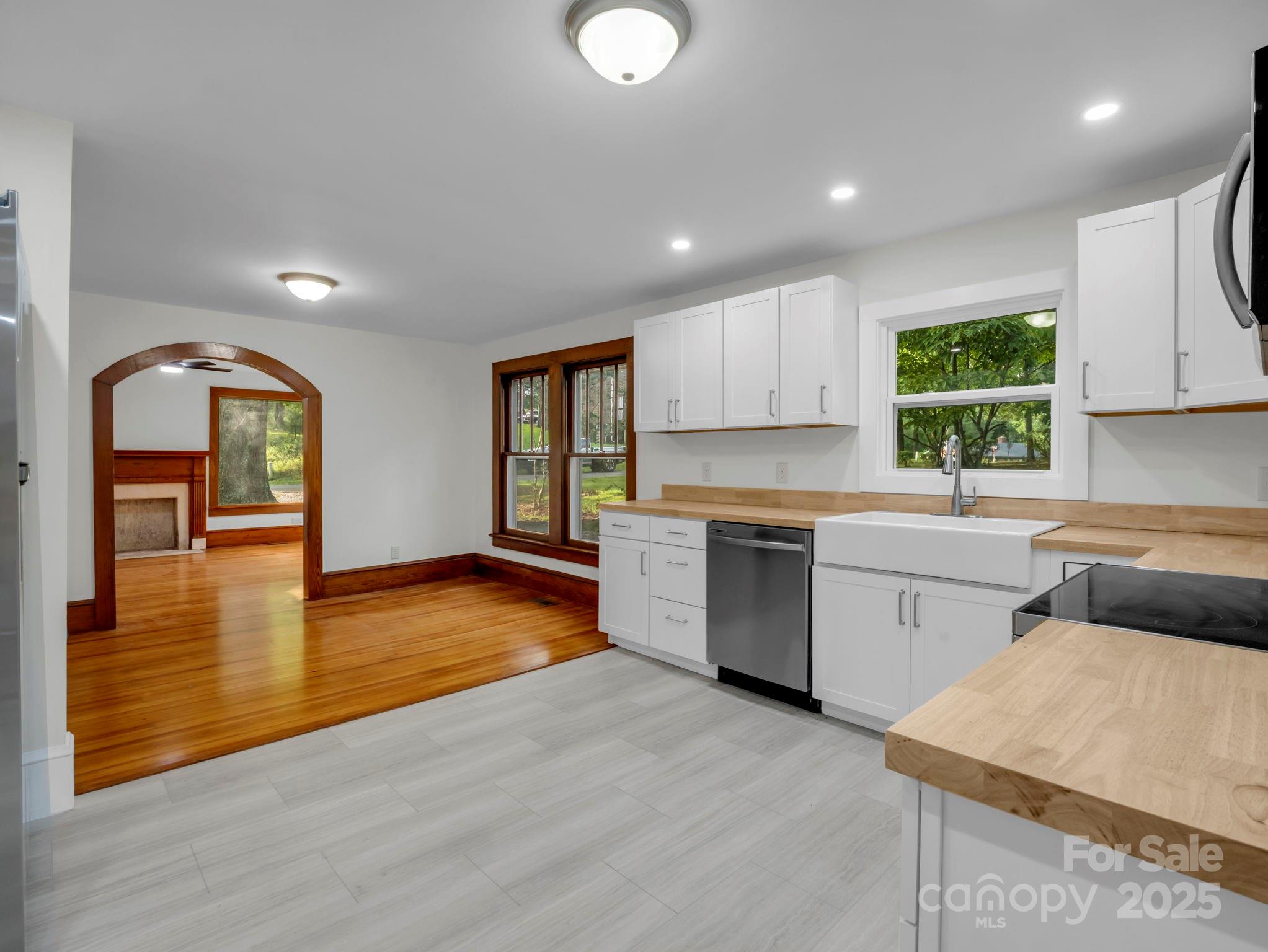 339 Flack Road Forest City, NC 28043 - Photo 28 of 32 a kitchen with a refrigerator and a stove top oven