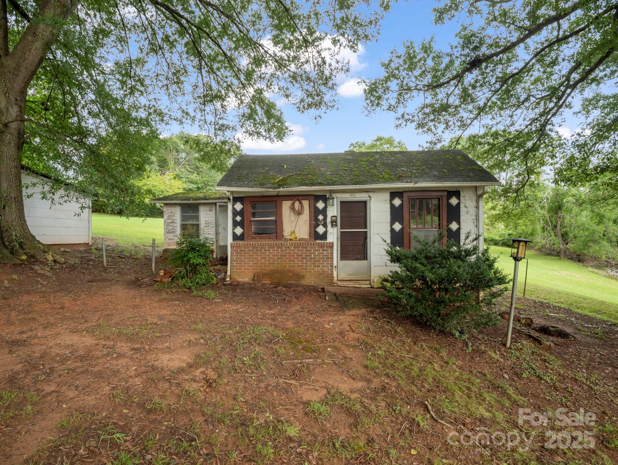 339 Flack Road Forest City, NC 28043 - Photo 31 of 32 a front view of a house with garden