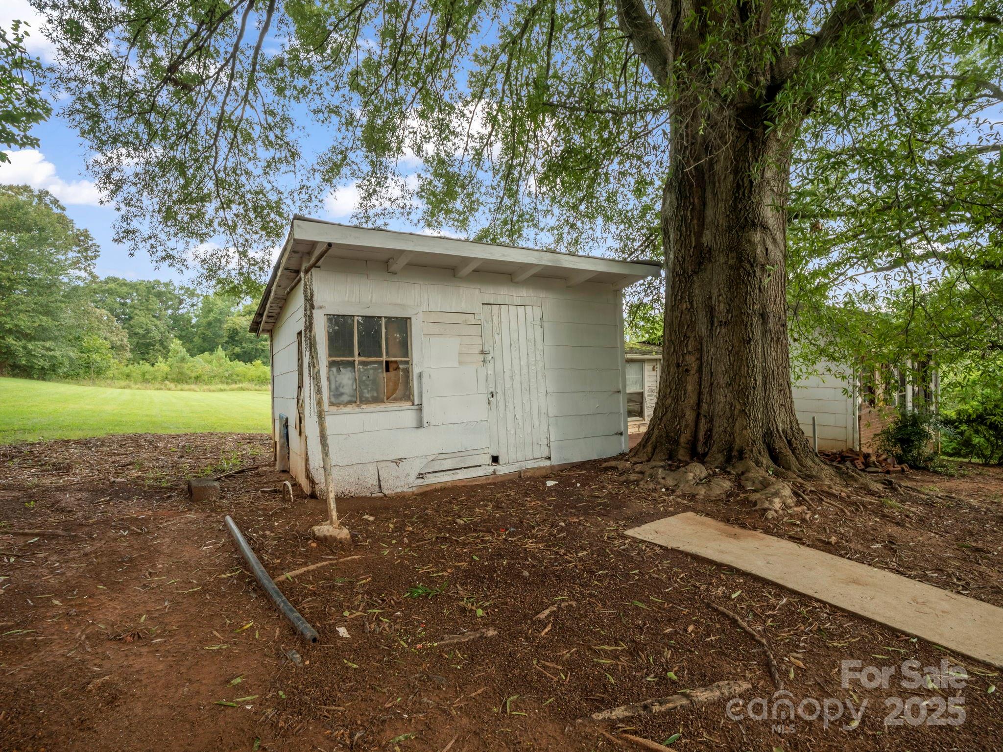 339 Flack Road Forest City, NC 28043 - Photo 32 of 32 a view of a house with a yard