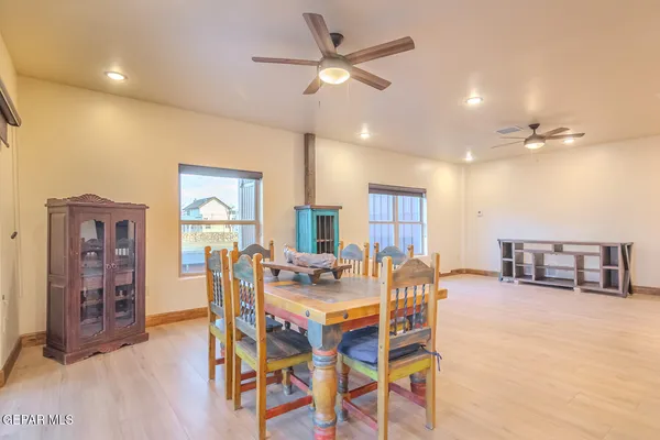 an empty room with a empty space and wooden floor