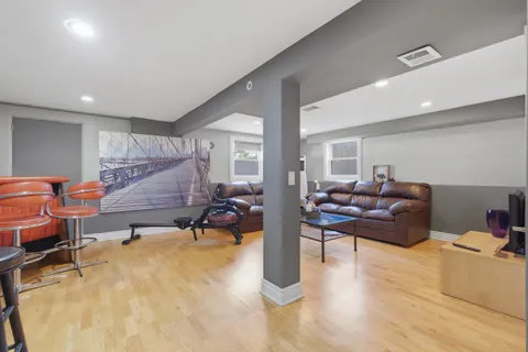 a living room with furniture window and wooden floor