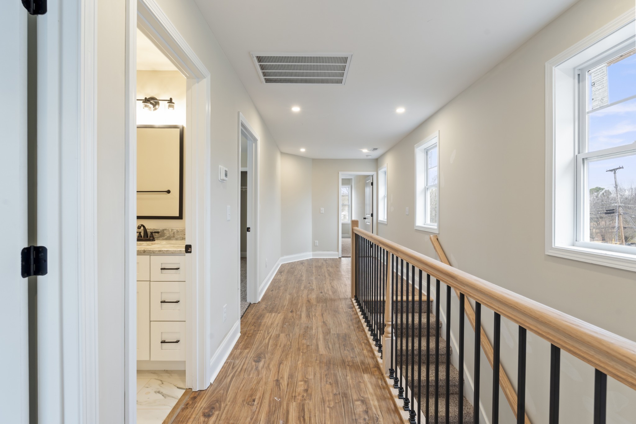 83 Charlotte Road Clarksville, TN 37040 - Photo 11 of 24 a view of a hallway with wooden floor and windows