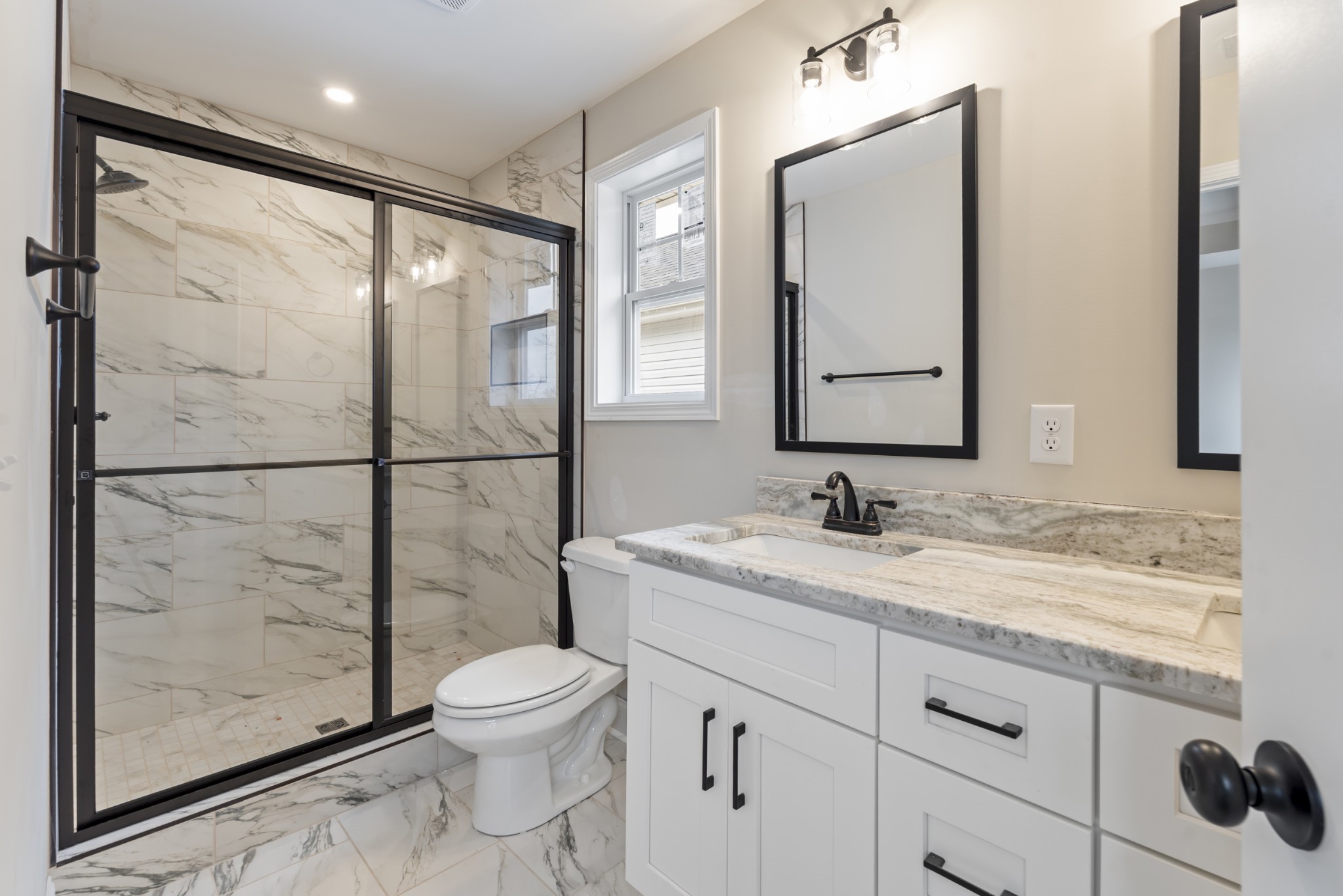 83 Charlotte Road Clarksville, TN 37040 - Photo 15 of 24 a bathroom with a granite countertop sink toilet a mirror and shower