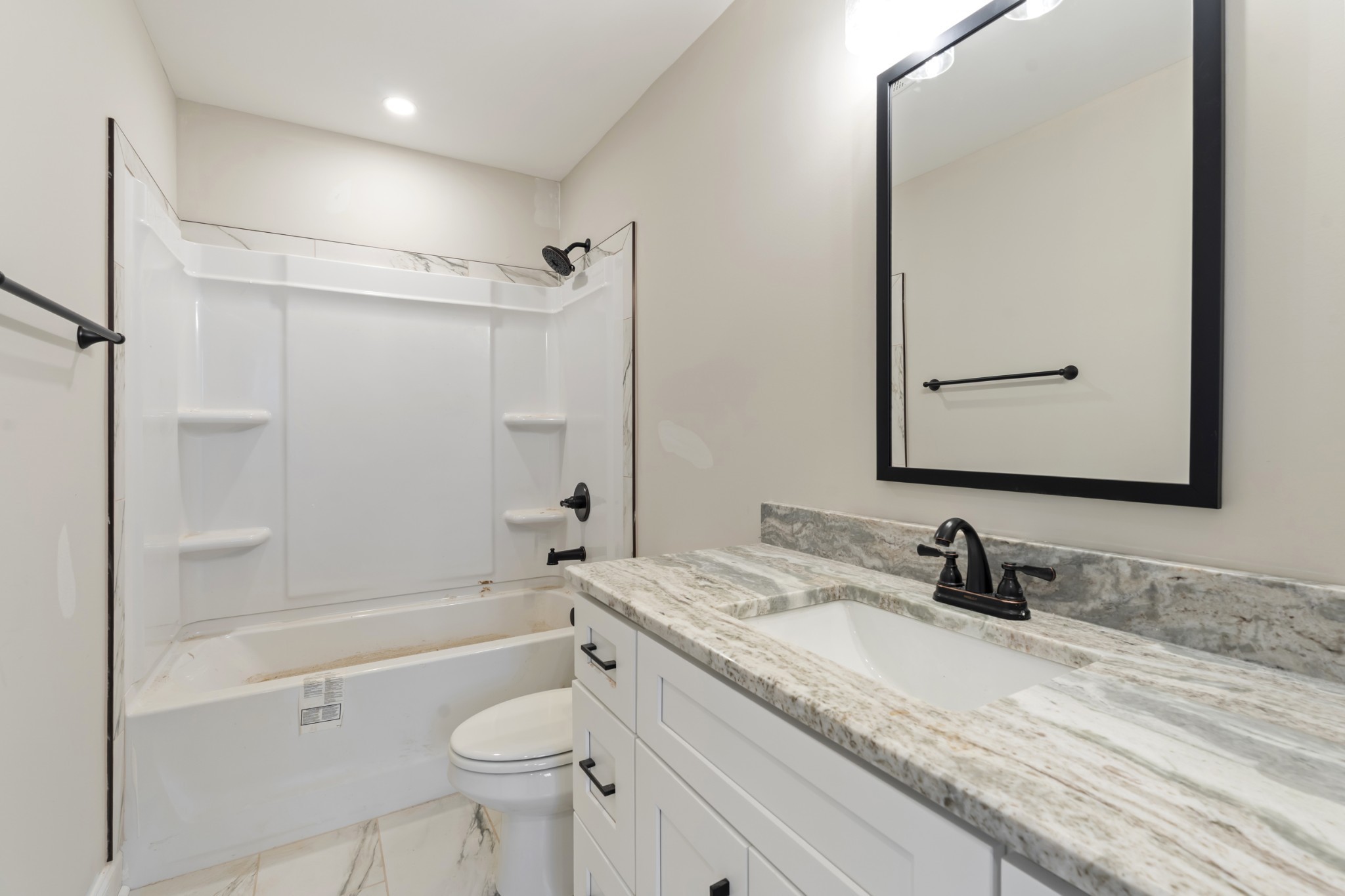 83 Charlotte Road Clarksville, TN 37040 - Photo 19 of 24 a bathroom with a granite countertop sink toilet and shower