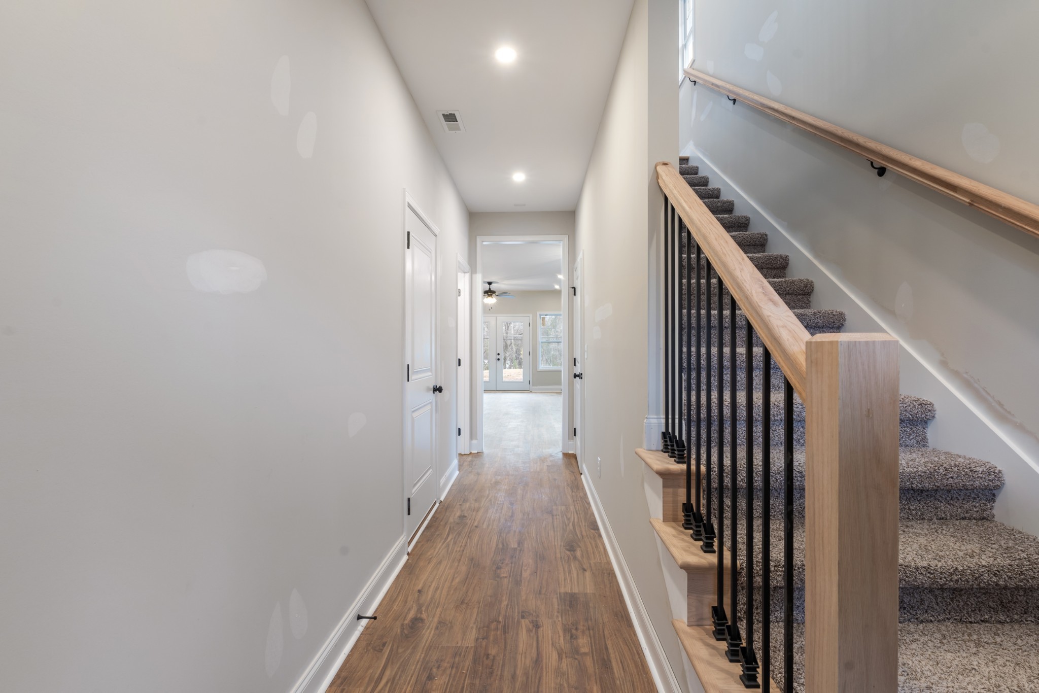 83 Charlotte Road Clarksville, TN 37040 - Photo 4 of 24 a view of a hallway with wooden floor and staircase