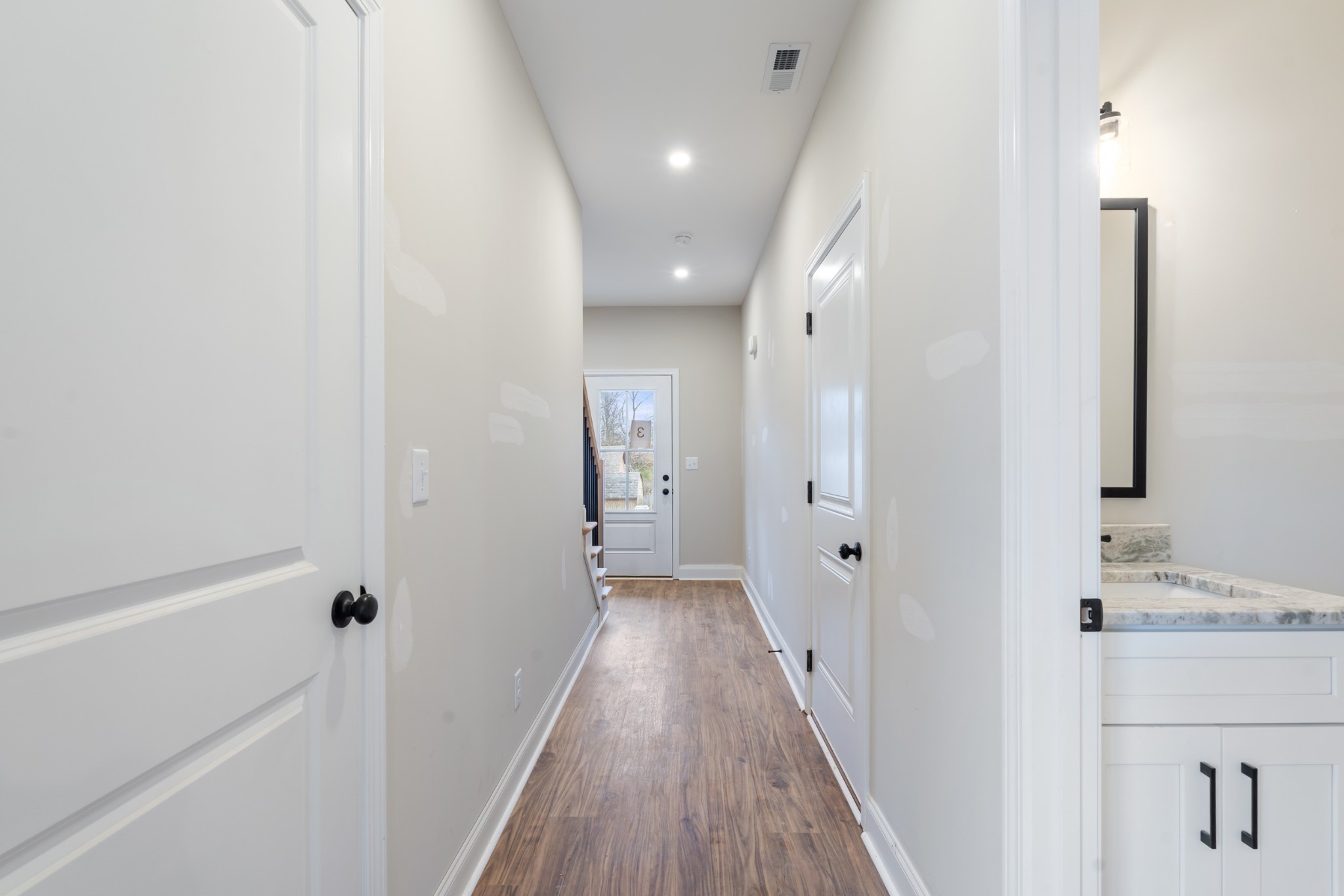 83 Charlotte Road Clarksville, TN 37040 - Photo 5 of 24 a view of a hallway with wooden floor