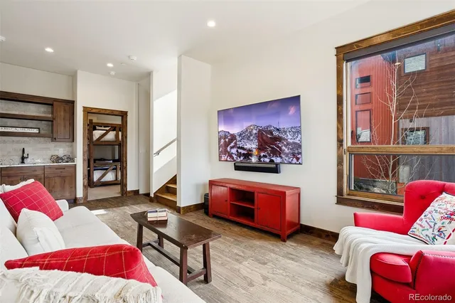 a living room with furniture and a painting