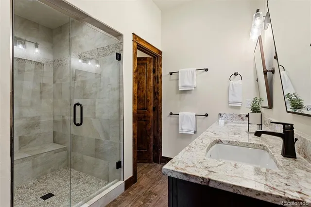 a bedroom with a bed next to a window